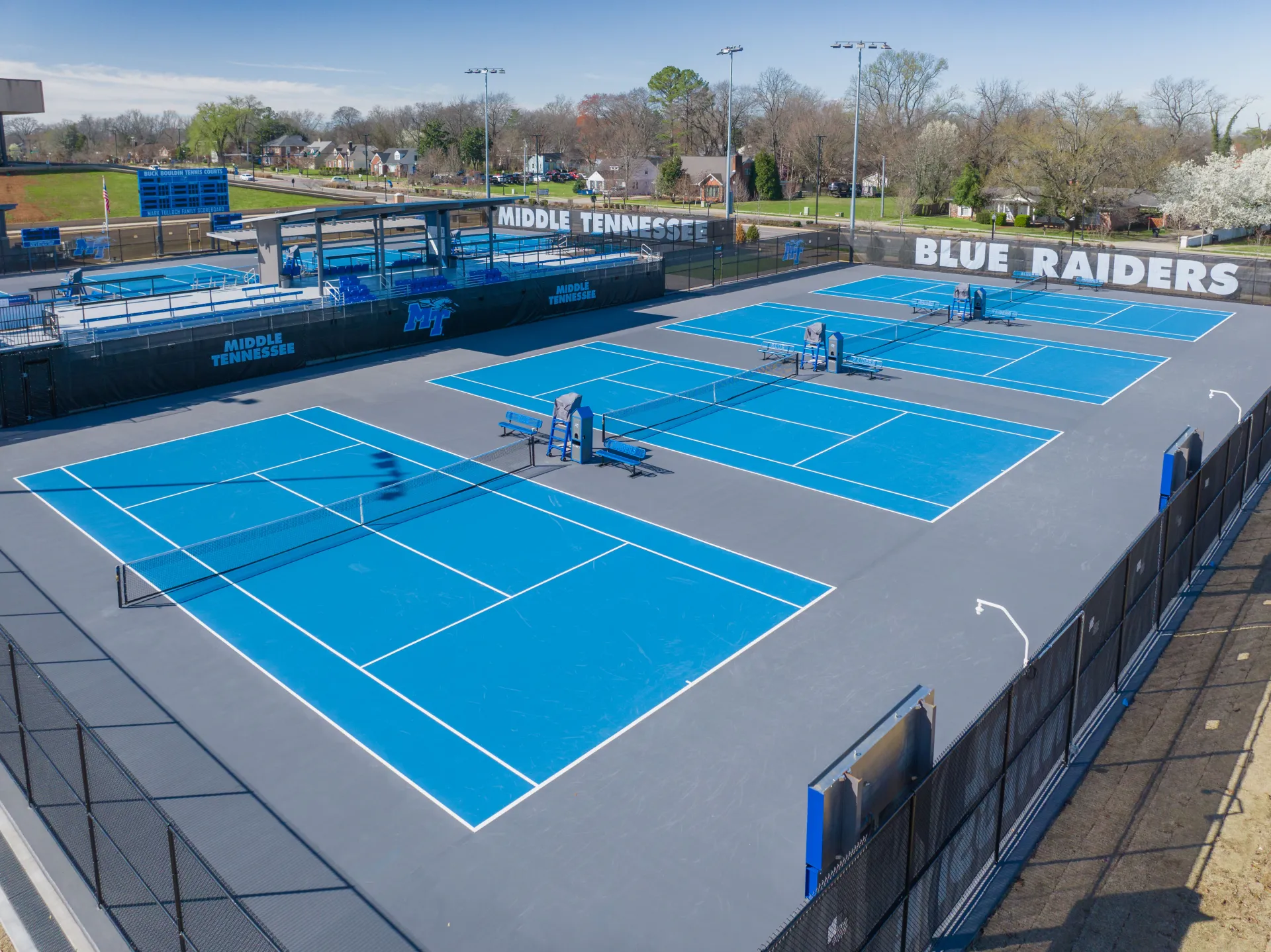 Finished university tennis courts with fresh acrylic surface